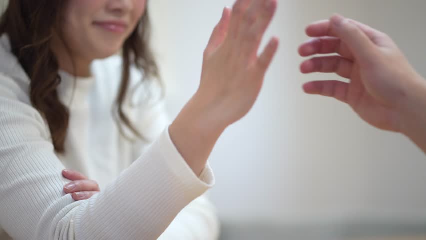 Image of a couple doing arm wrestling
