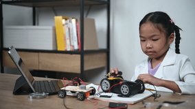 Asian littlle girl constructing and coding robot at STEM class,Fixing and repair mechanic toy car - Powered by Shutterstock - Get 15% off with code: PIKWIZARD15