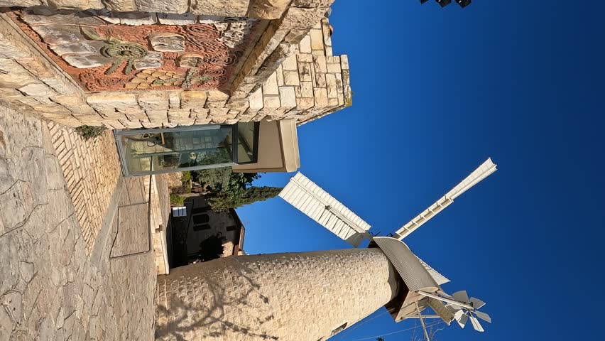 The famous and ancient windmill in the Yemin Moshe neighborhood in Jerusalem - Israel, against a clear sky