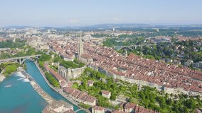 Inscription on video. Bern, Switzerland. Historic city center, general view, Aare river. Multicolored text appears and disappears, Aerial View