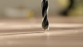 Close view of drilling holes in wood with drill. Close-up of furniture assembly in manufacturing plant. carpenter does his work with help of cordless screwdriver or drilling machine. - Powered by Shutterstock - Get 15% off with code: PIKWIZARD15
