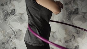 hula hoop. home fitness. restoring the figure. slow motion - Powered by Shutterstock - Get 15% off with code: PIKWIZARD15