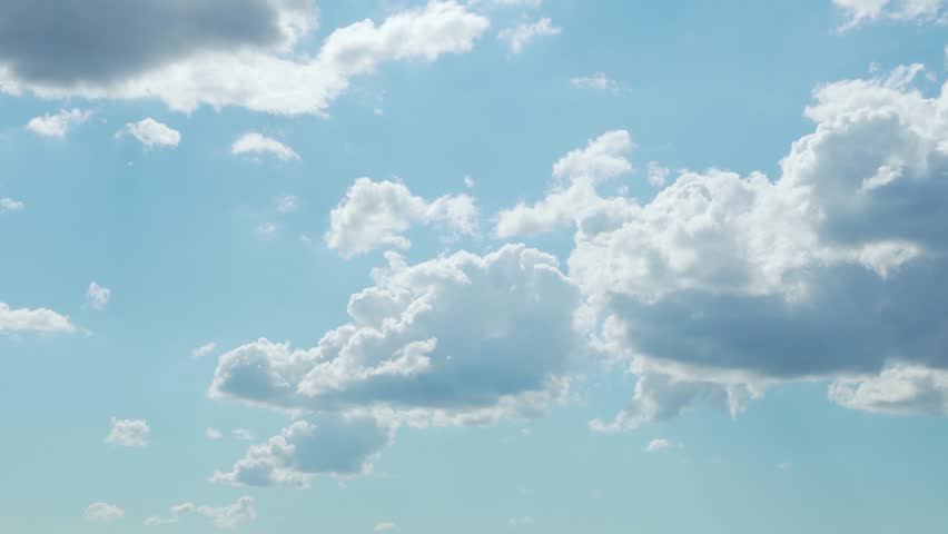 Beautiful Soaring White Clouds in Sunlight in Light Blue Sunny Sky Timelapse. Amazing View Blue Skyscraper Cumulus Clouds and Sun. Sunny Pyffy Clouds Time Lapse. Beauty, Relax, Atmosphere, Heaven. | Shutterstock HD Video #1099661713