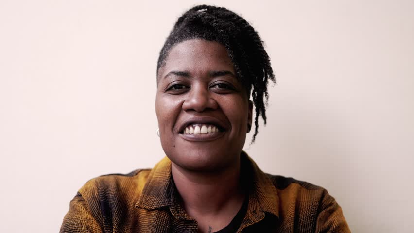 Young African american woman smiling at camera outdoor