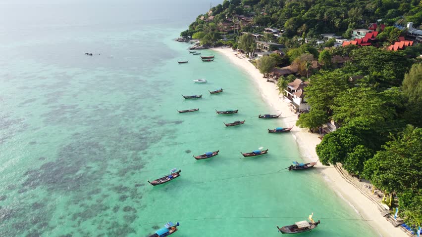 Amazing aerial view of the sandy beach in Koh Lipe island, Thailand, Asia. Tropical travel destination. Summer vibes. | Shutterstock HD Video #1099665915