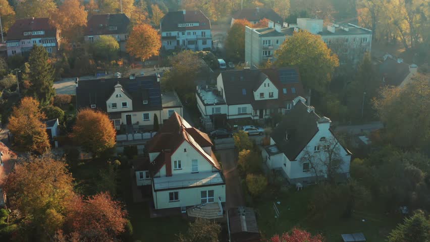 Solar panels on the roofs of country houses of houses for the production of clean electricity in a modern European city. aerial view of private houses in european city.  Royalty-Free Stock Footage #1099668505