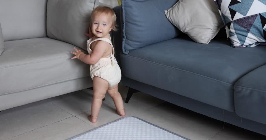 Authentic close up Cute Caucasian Baby Girl 1 year old Playing on floor in living room at home.  | Shutterstock HD Video #1099669773