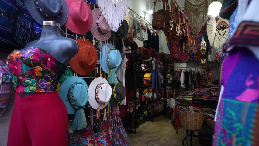 Hats and colorful blouses and clothing in a tourist souvenir shop in Merida, Yucatan, Mexico.