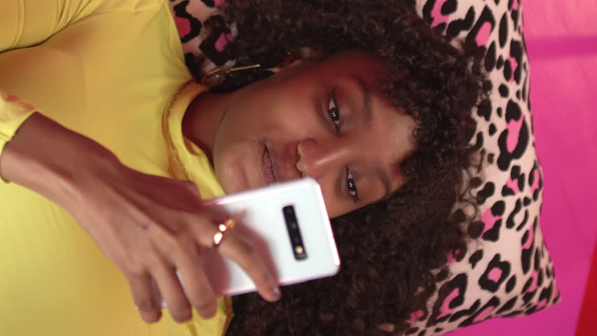 Overhead shot of young adult female looking at a smartphone