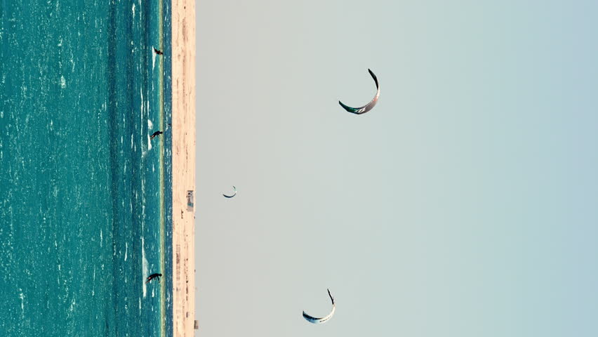 Windsurfing kite surfing turquoise waters, Egyptian beach horizon vertical video | Shutterstock HD Video #1099676827