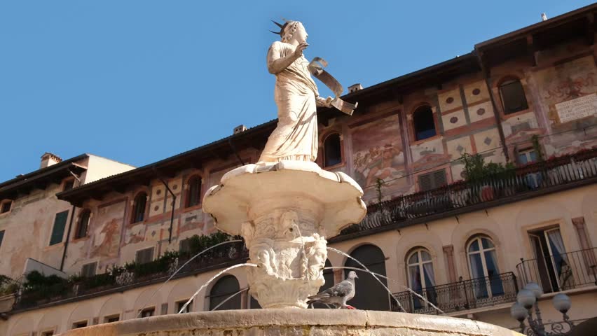 Madonna Verona Fountain, roman statue on Piazza delle Erbe in Verona, Italy. Royalty-Free Stock Footage #1099676895