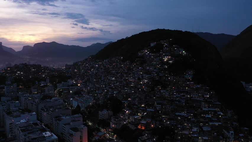 Cantagalo-Pavao-Pavaozinho Favelas at Evening Twilight. Blue Hour. Rio de Janeiro, Brazil. Aerial View. Orbiting Royalty-Free Stock Footage #1099677791