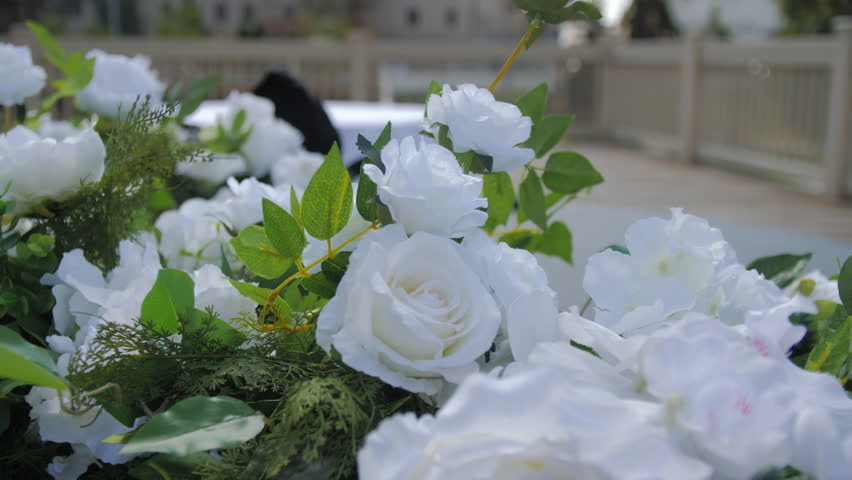 Wedding flowers wall as decorations on filming set for shooting scene. Preparation of celebration place for filming upcoming movie | Shutterstock HD Video #1099678575