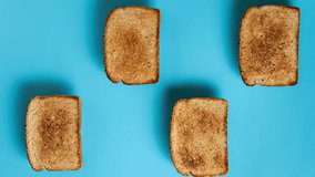 Vertical Video Stop Motion Of Different Types Of Bread Toasts, Sweet And Savory Toasts, On A Flat Blue Background