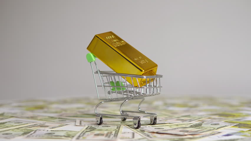 Gold bar in small shopping trolley cart. Online trading or buy gold bars for investment. Gold is store of value in recession crisis. | Shutterstock HD Video #1099682373
