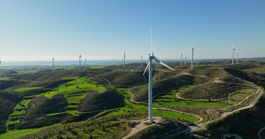 Aerial view of industrial production of electricity by windmills in the mountains. Environmentally clean wind energy. Power propellers rotate producing electricity. High quality 4k footage | Shutterstock HD Video #1099683293
