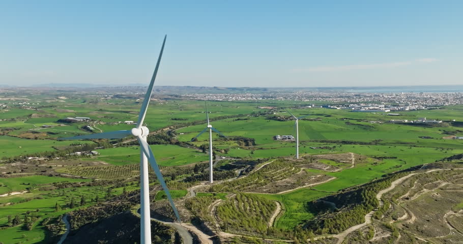 Aerial view of a beautiful landscape of a wind farm in Cyprus. Production of electricity in an alternative way from wind energy. Ecologically clean sources of energy. High quality 4k footage | Shutterstock HD Video #1099683321