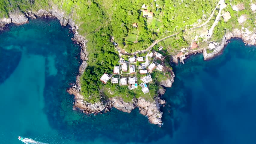 Greek House in Arraial do Cabo, Brazil - Rio de Janeiro. Beautiful day with turquoise blue water. Drone footage in 4k. | Shutterstock HD Video #1099684527