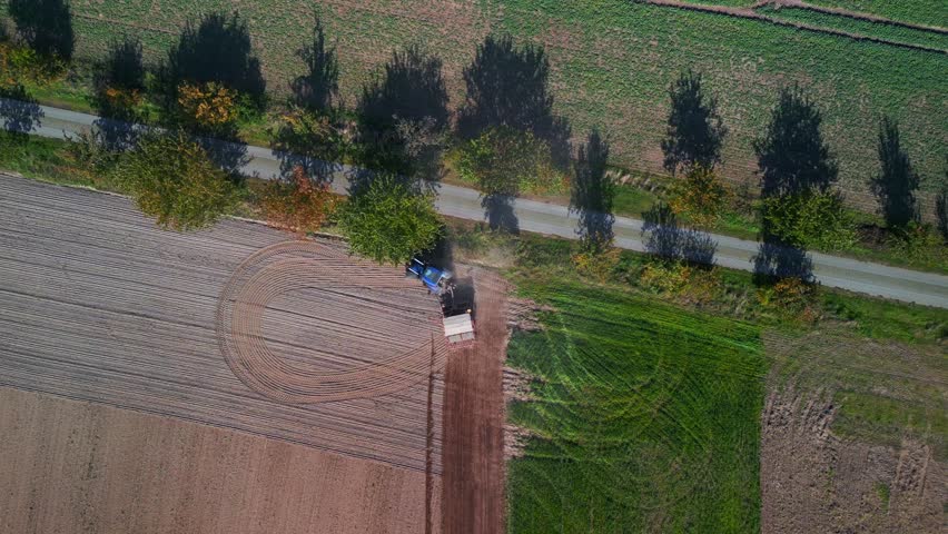 Tractor on fall field brandenburg Germany. Fabulous aerial view flight drone | Shutterstock HD Video #1099687931