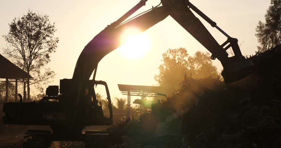 backhoe silhouette with construction site,excavators work on construction site at sunset,steel wool backhoe Royalty-Free Stock Footage #1099689945