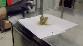 chef pastry baker finishing salty caramel frosted dripping cakes with meringues and chocolate golden heart shaped handmade topper 4k footage - Powered by Shutterstock - Get 15% off with code: PIKWIZARD15