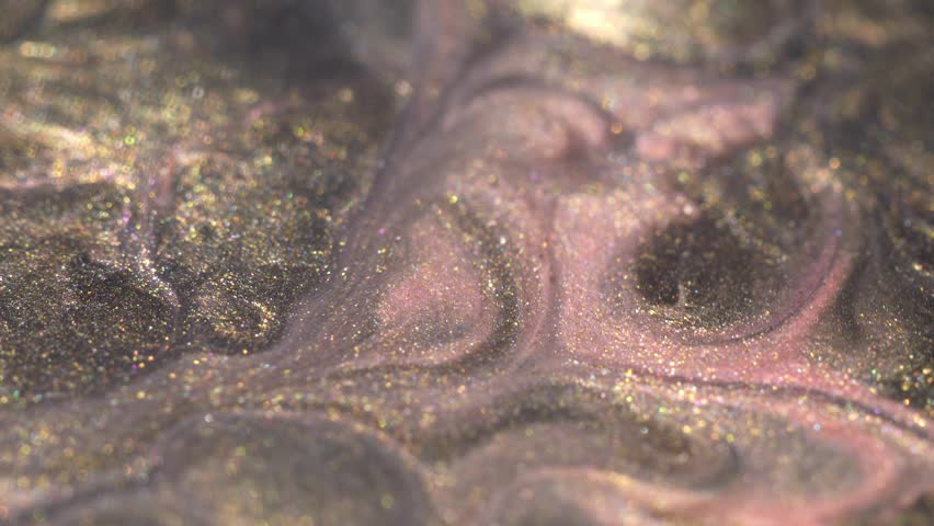 Metallic Liquid Cameleon Holographic Ink Mix Macro. Light gold and pink paint are mixed | Shutterstock HD Video #1099691403