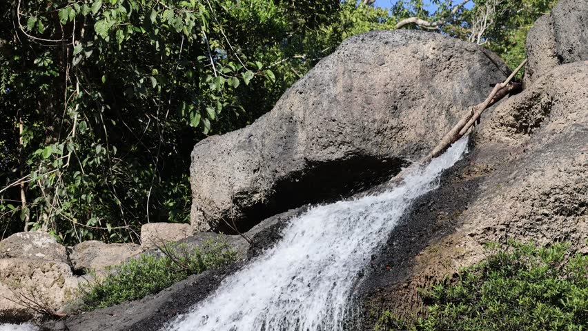 Waterfall rushing on rock, Waterfall in tropical forest. | Shutterstock HD Video #1099695313