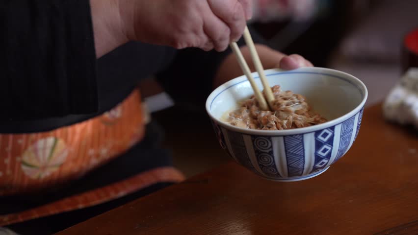 Image of a woman mixing Japanese natto
 Royalty-Free Stock Footage #1099700257