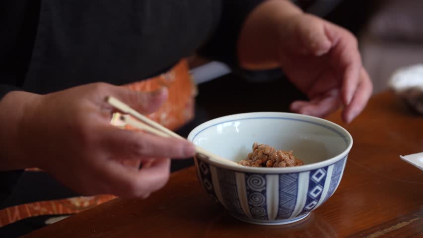 Image of a woman mixing Japanese natto
 Royalty-Free Stock Footage #1099700261