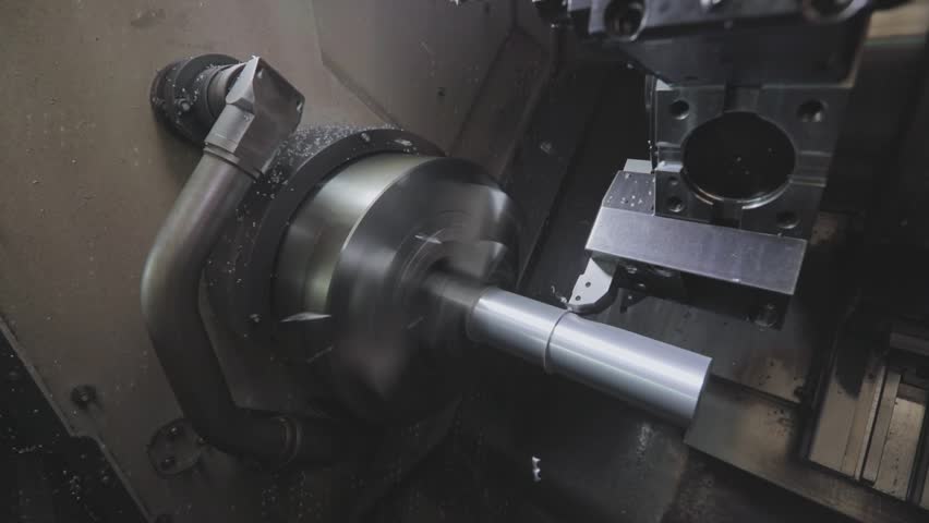 Creation of a metal part on a CNC machine. CNC machine will create a metal part. Metal processing on a cnc machine. Royalty-Free Stock Footage #1099703953