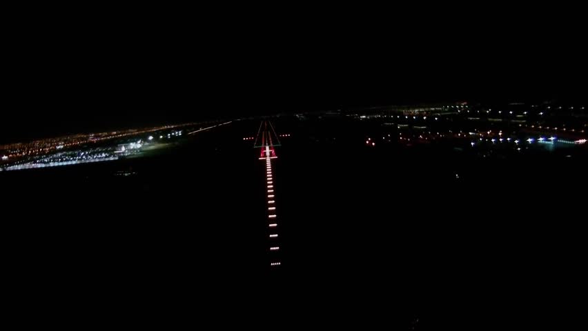 POV Shot From A Cockpit Of An Airplane Landing On Runway at Night Hour. Royalty-Free Stock Footage #1099705573
