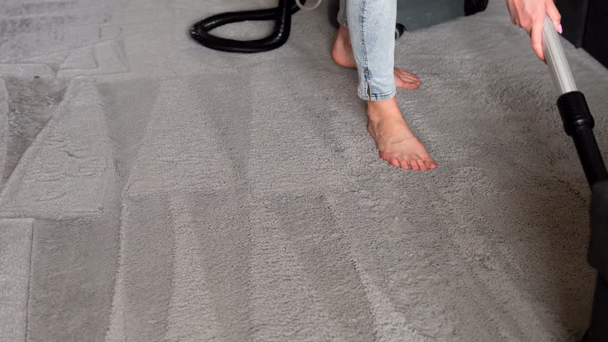 Cleaning soft carpet with water vacuum cleaner. Modern housekeeping appliance.  | Shutterstock HD Video #1099708271