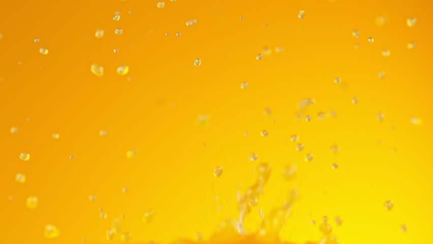 Super Slow Motion Shot of Pouring Fresh Orange Juice at 1000 fps. Royalty-Free Stock Footage #1099709135