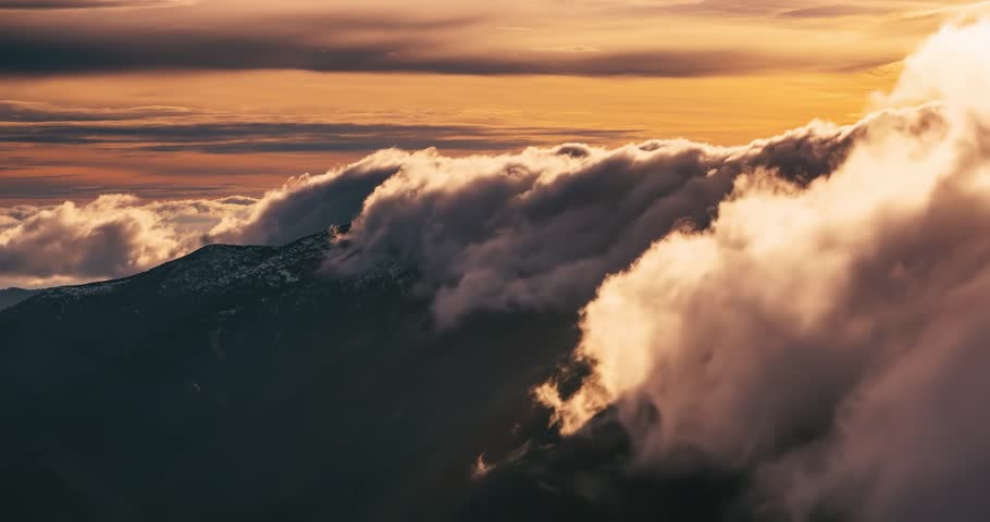 Misty clouds motion fast over alpine mountains ridge nature at sunrise Time lapse
 | Shutterstock HD Video #1099709225