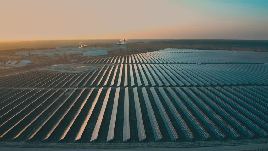 Aerial photography from a drone of solar panel systems in a field. | Shutterstock HD Video #1099710743