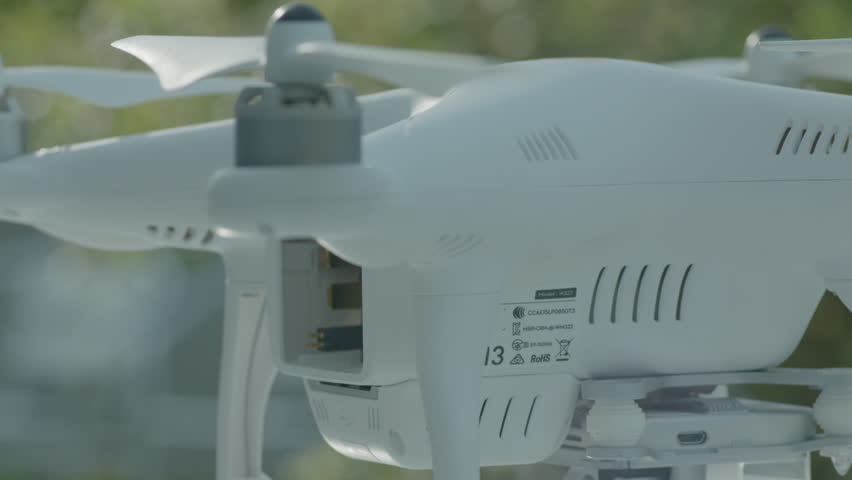 Aerial shooting drone battery replacement hand close-up | Shutterstock HD Video #1099712485