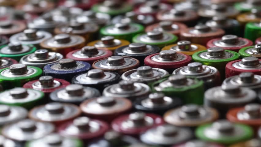 Macro image of a group of colored batteries rotating in a circle. | Shutterstock HD Video #1099713591