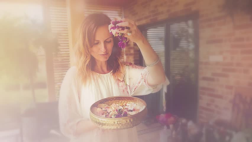 flower for the preparation of essential oil. Spa and aromatherapy. Pouring flowers into the cape.