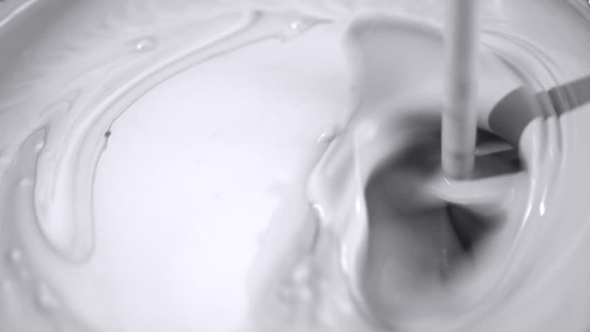 Construction mixer mixes white paint with bubbles | Shutterstock HD Video #1099720291