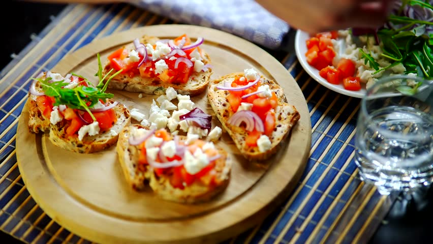 Tasty Tapas On Serving Board Antipasti Brunch. Delicious Tapas ,Cheese ,Tomatoes. Spanish Restaurant Traditional Food. Appetizer Homemade Antipasto. Catering Mediterranean Food Spanish Tapas Starter  | Shutterstock HD Video #1099720495