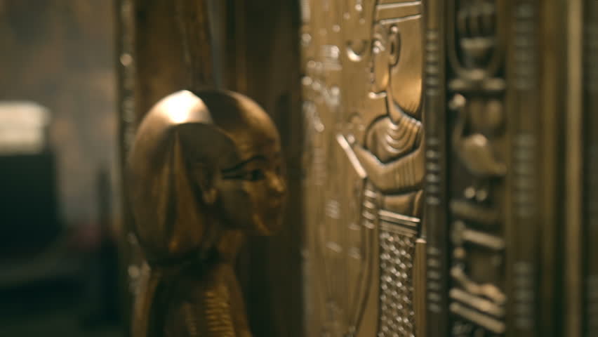 Golden ancient Egyptian frescoes on the walls of tombs and pyramids depict the Ancient Egyptians, queens, kings, pharaohs, various deities and all this is signed with hieroglyphs and ancient symbols Royalty-Free Stock Footage #1099720727