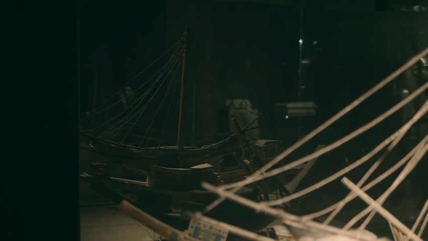 Wooden models of ancient Egyptian sailing and rowing boats with rigging, found during excavations in Egypt. Shot in motion. Closeup Royalty-Free Stock Footage #1099720743