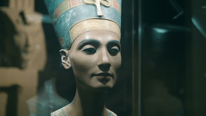Plaster bust of Nefertiti is one of the exhibits of the tomb of pharaoh, a symbol of Ancient Egypt. Shot in motion. Closeup - Powered by Shutterstock - Get 15% off with code: PIKWIZARD15