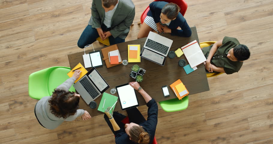 Startup, business meeting people with portfolio, technology laptop or tablet collaboration, digital marketing strategy and finance report analysis. Creative, finance and team for kpi document review