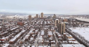 A breathtaking aerial view of Quebec City in winter, captured by drone and showcasing the magnificent skyline of this historic city