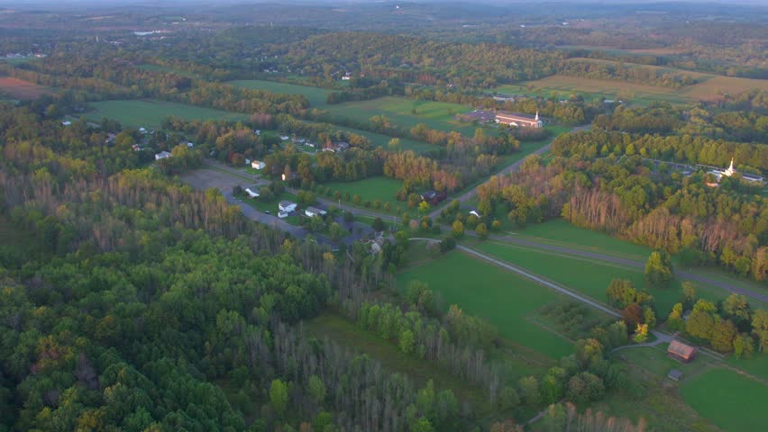Drone Full view of all the historic sites near the Joseph Smith family farm, frame house, temple, visitors center, sacred grove in Palmyra New York Origin locations for the the book of Mormon. | Shutterstock HD Video #1099734351