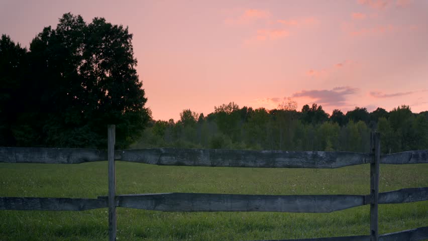 Fence of a farm at sunset near the Joseph Smith family farm, frame house, temple, visitors center, and the sacred grove in Palmyra New York Origin locations for the Mormons and the book of Mormon. | Shutterstock HD Video #1099735649