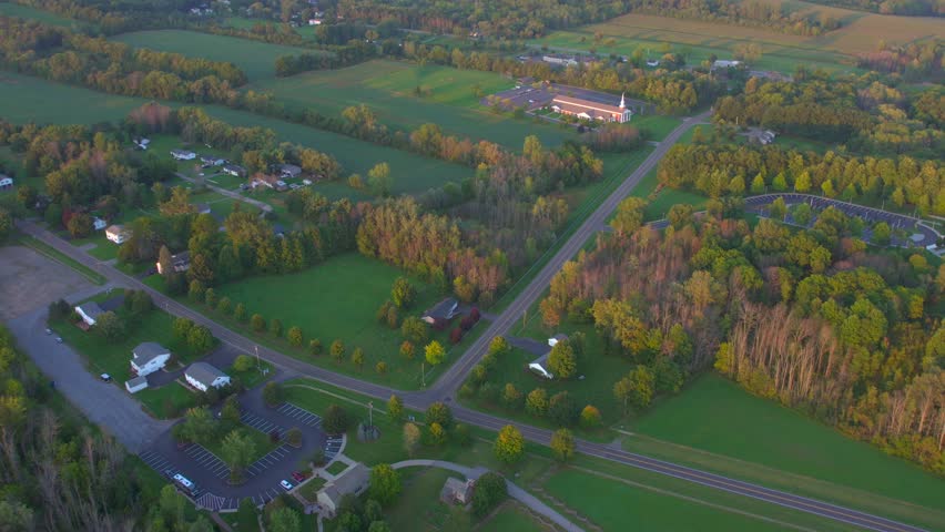 Drone shot LDS Church and Temple near the Joseph Smith family farm, frame house, temple, visitors center, sacred grove in Palmyra New York Origin locations for the Mormons and the book of Mormon. | Shutterstock HD Video #1099735651