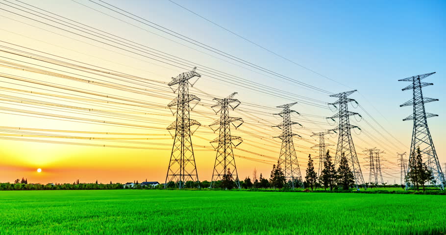 High voltage electric towers at sunset. Transmission power line. Electricity pylons and sky clouds background. | Shutterstock HD Video #1099737413