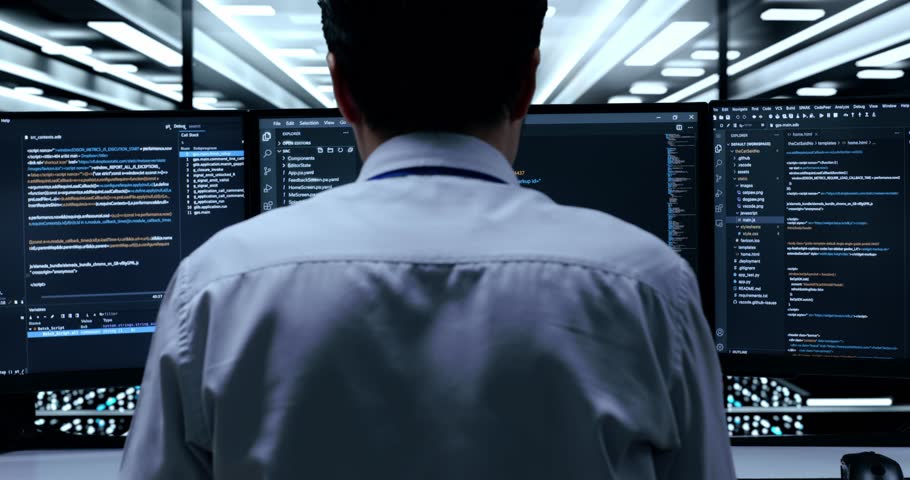 Close Up Back View Of Asian Male Programmer Being Stressed And Tired Of Writing Code By Desktops Using Multiple Monitors Showing Database On Terminal Window In The Server Room
 | Shutterstock HD Video #1099738387